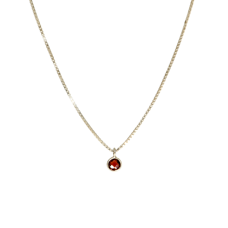 Tiny garnet pendant on sterling silver box chain, front view