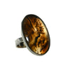 Ring with a brown oval stone on a white background