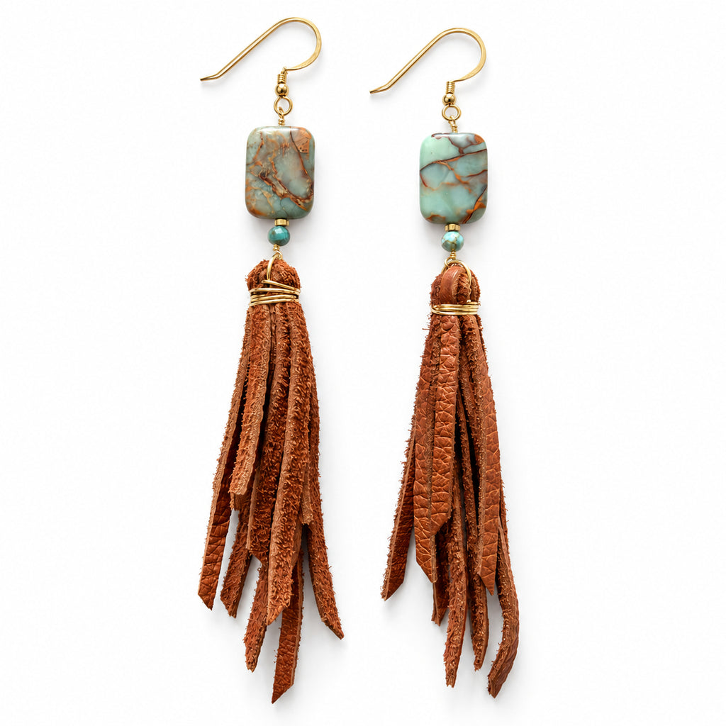 Woman wearing Aqua Terra jasper gold-filled leather tassel earrings