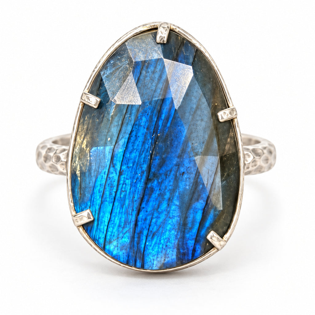 Blue flash labradorite teardrop ring in six-prong sterling silver setting, front view.