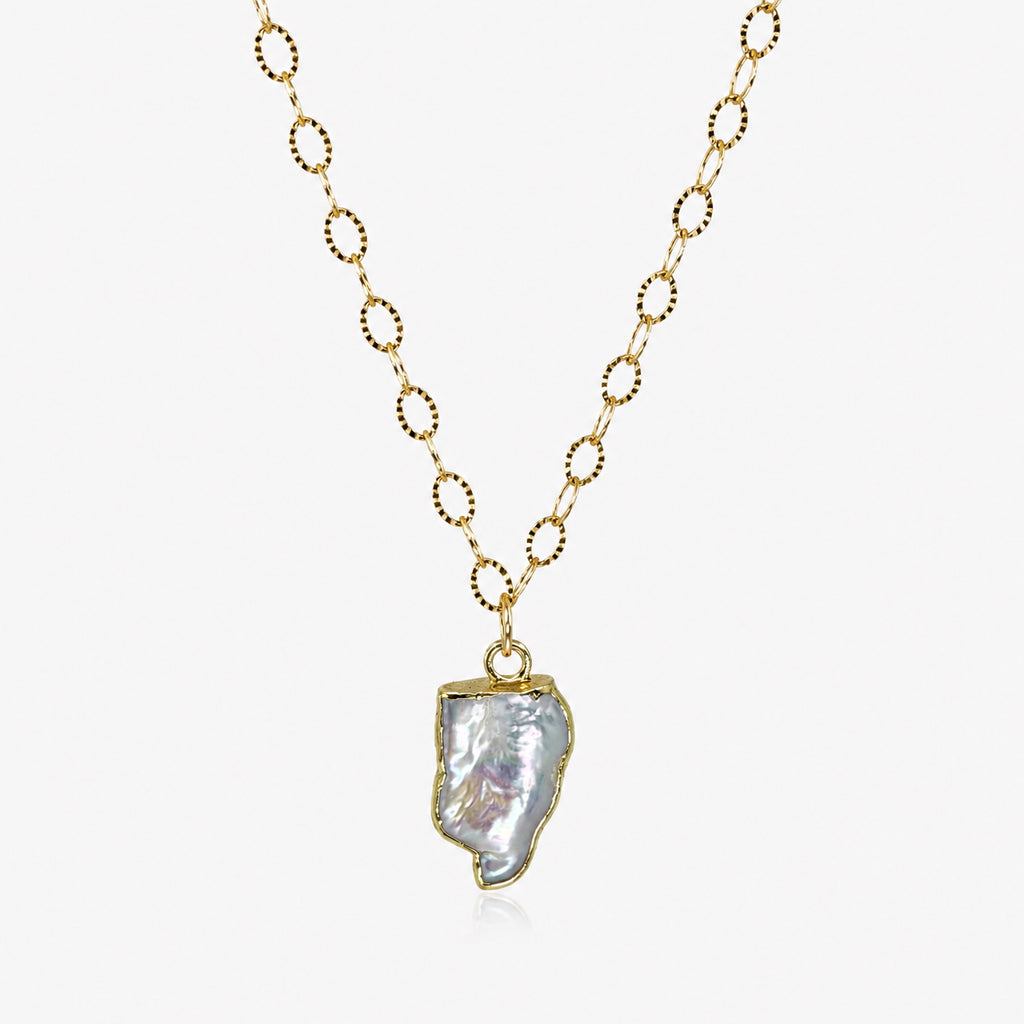 Woman wearing freeform freshwater pearl necklace with electroformed gold-filled cap on textured oval link chain"