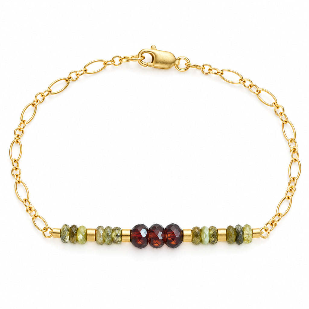 Woman wearing the red and green garnet gold-filled beaded chain bracelet