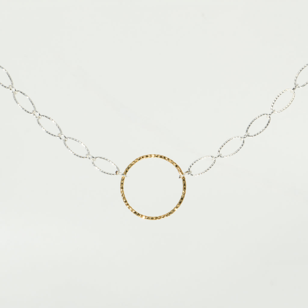 Woman wearing gold-filled circle choker necklace on sterling silver chain