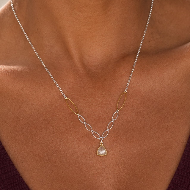 Faceted natural green amethyst pendant in a gold-vermeil bezel on a mixed-metal necklace