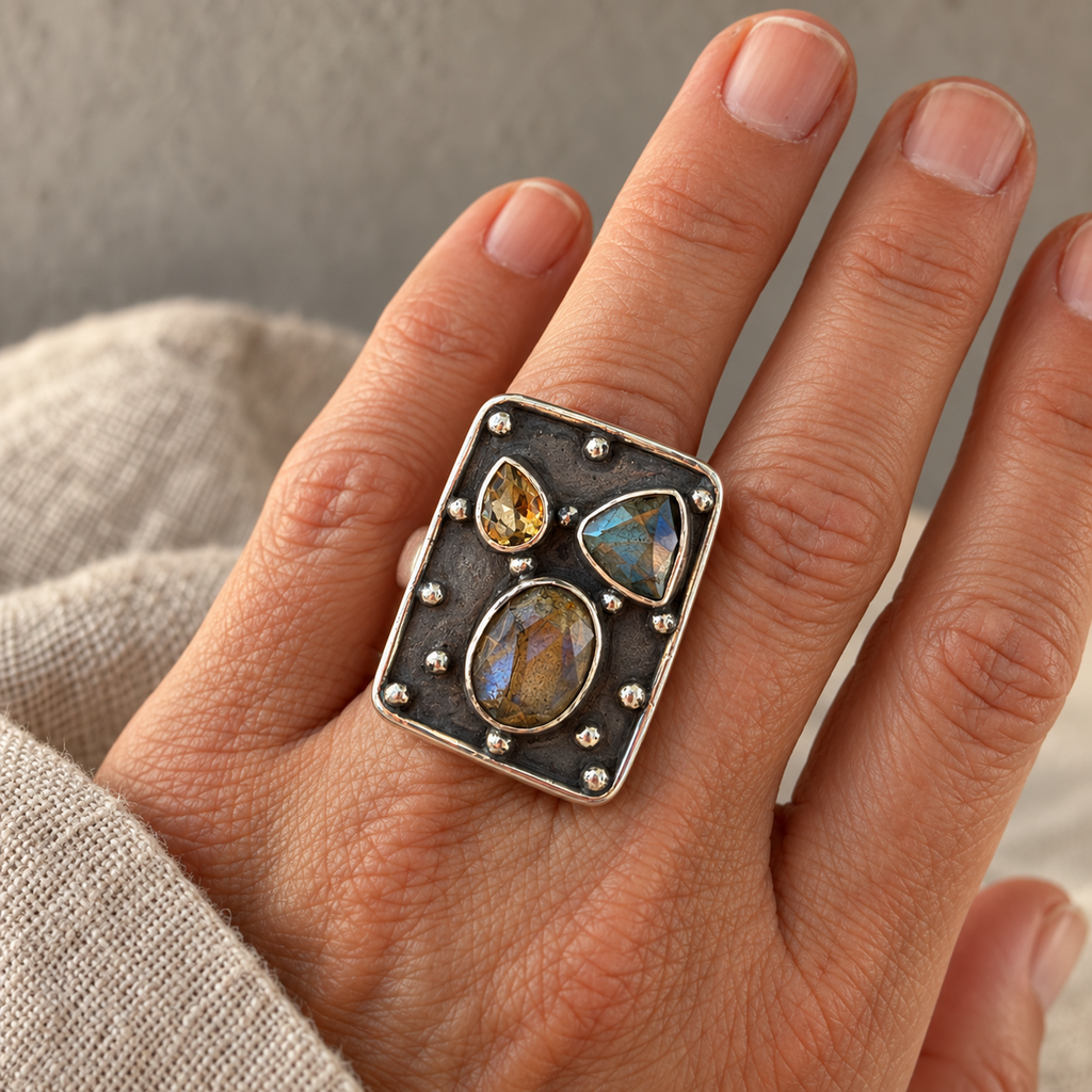 Labradorite and citrine constellation ring in oxidized sterling silver, front product view.