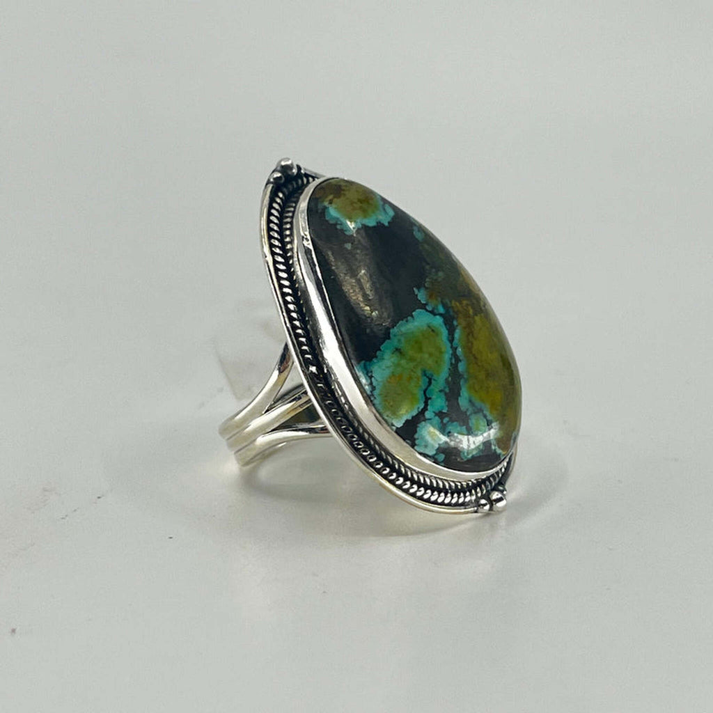 Large pear turquoise ring in sterling silver with beaded border, front product view.