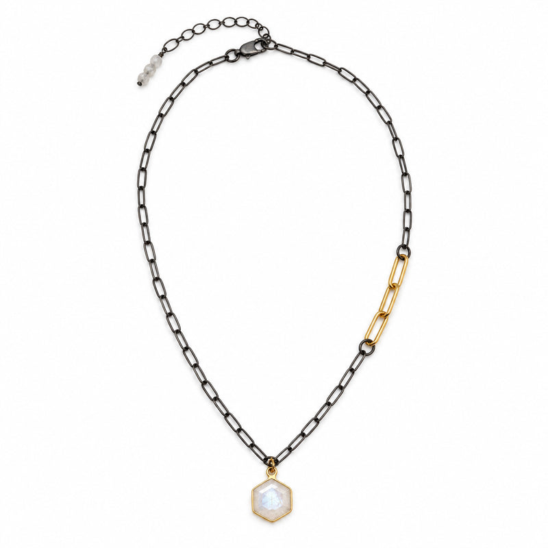 Rainbow moonstone hexagon necklace in a gold bezel on an oxidized silver paperclip chain with three gold links, full view