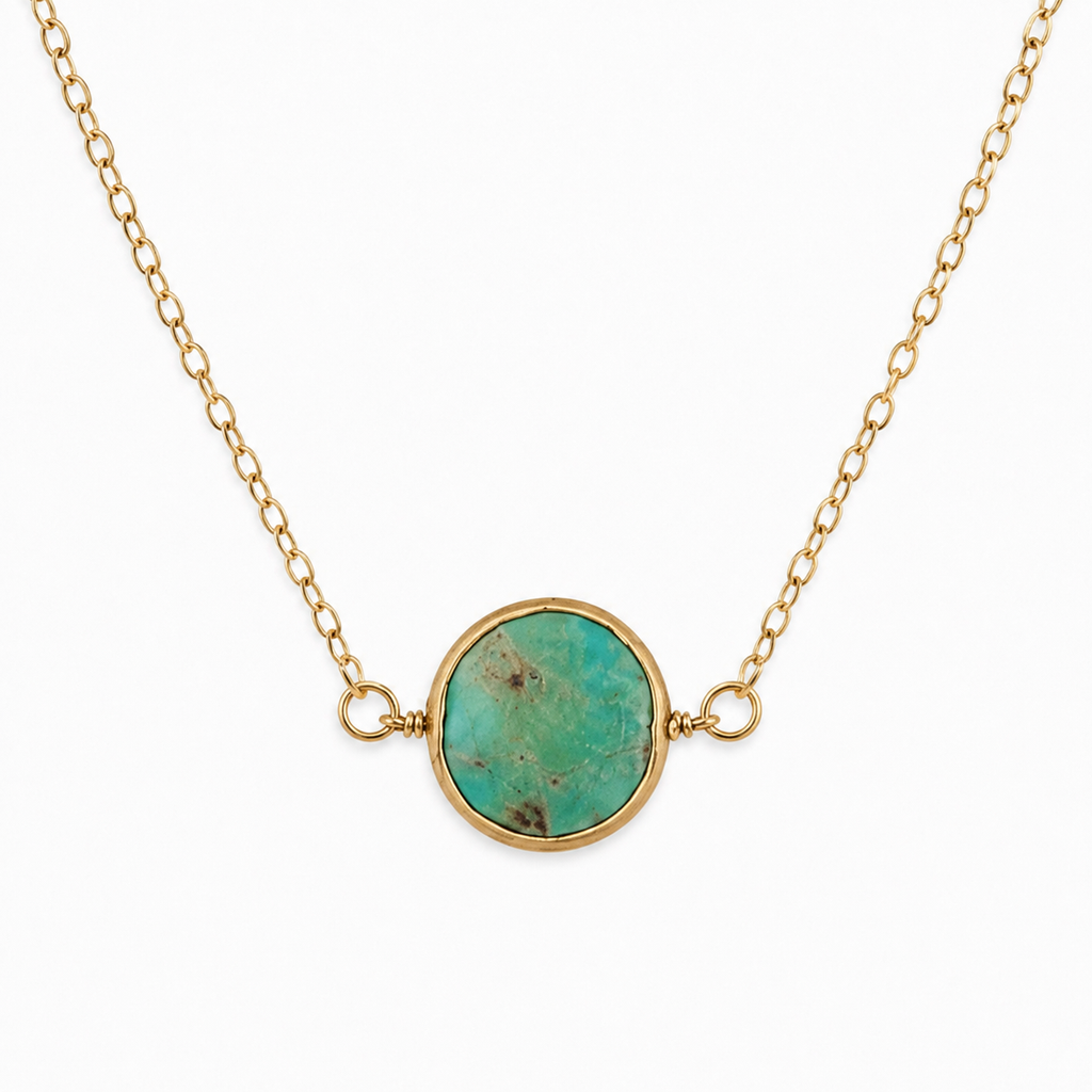 Natural variation of a green turquoise circle necklace showing dark matrix and a gold-filled chain