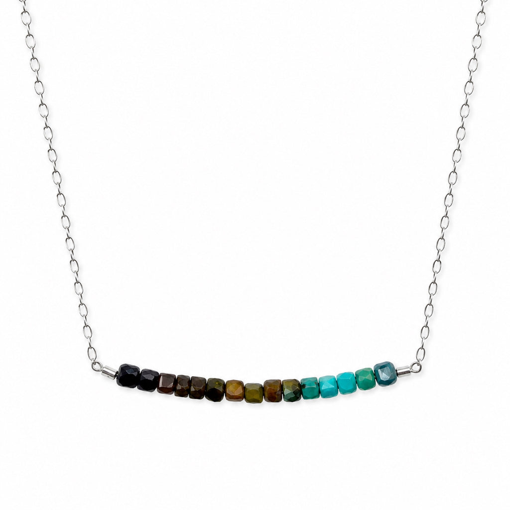 Model wearing a natural turquoise bar necklace in sterling silver