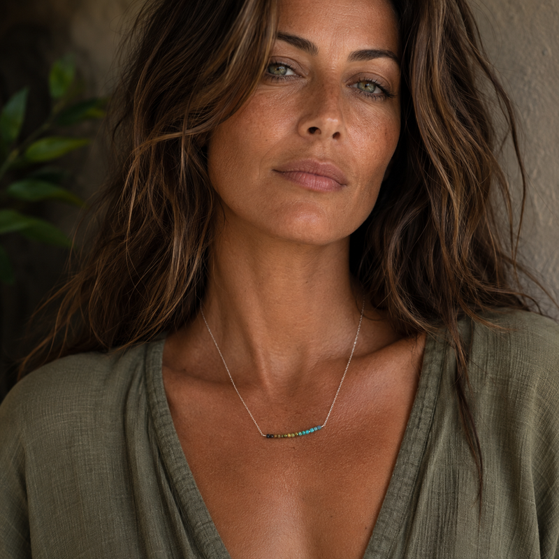Model wearing a natural turquoise bar necklace in sterling silver
