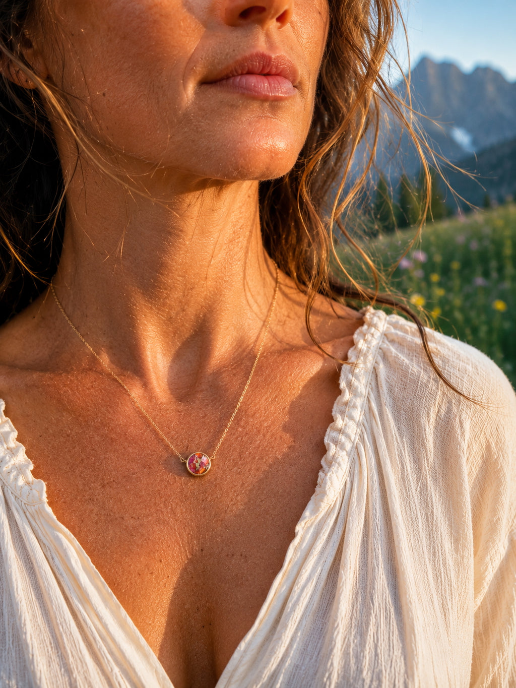 Close-up of pink oyster turquoise in antique brass pendant setting