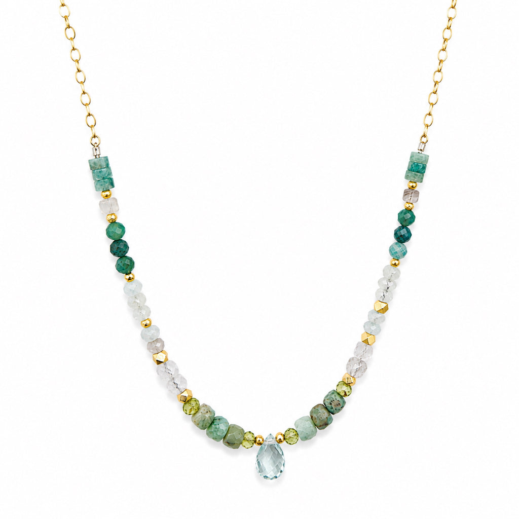 Close-up of faceted aquamarine briolette drop with amazonite and moonstone beads