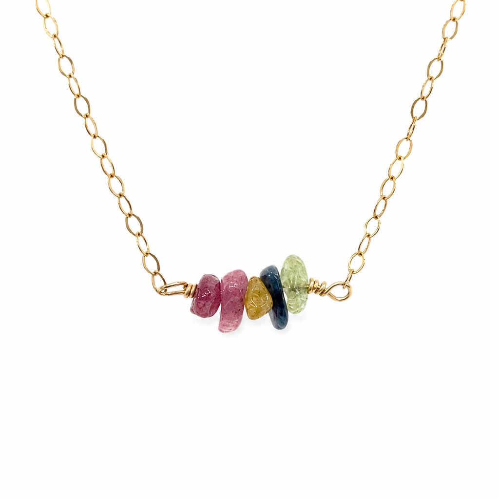 Woman wearing a rainbow tourmaline chip necklace