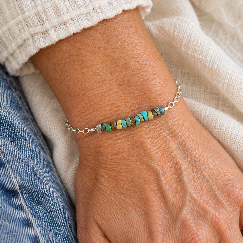 Turquoise heishi sterling silver bracelet on white background, full product view